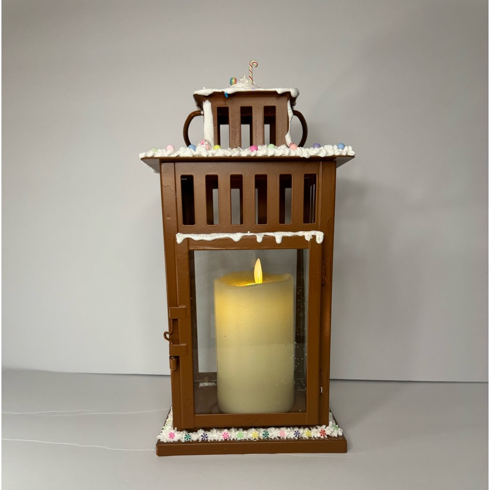 Gingerbread themed lantern, frosted with sprinkles, with candy